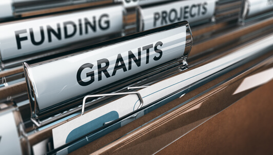 filing folders showing grants and funding tabs